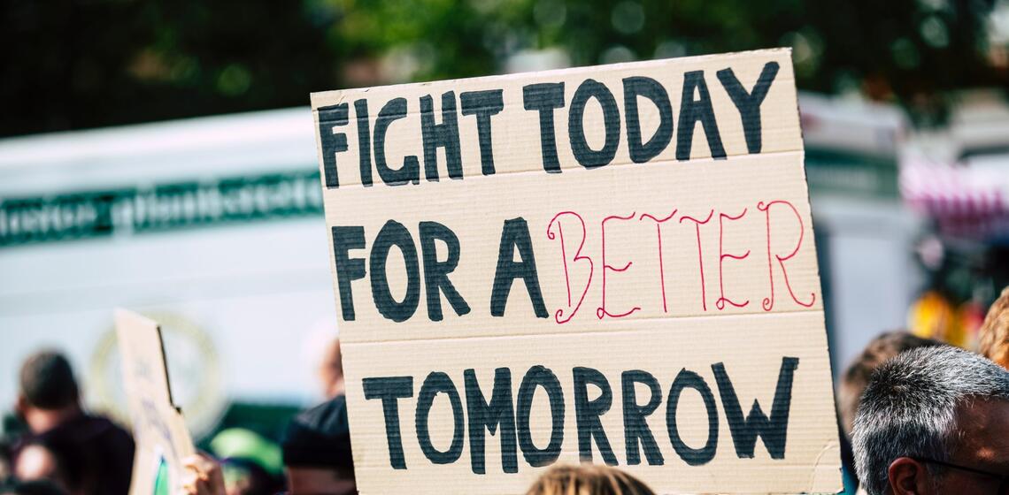 Sign reading "Fight today for a better tomorrow"