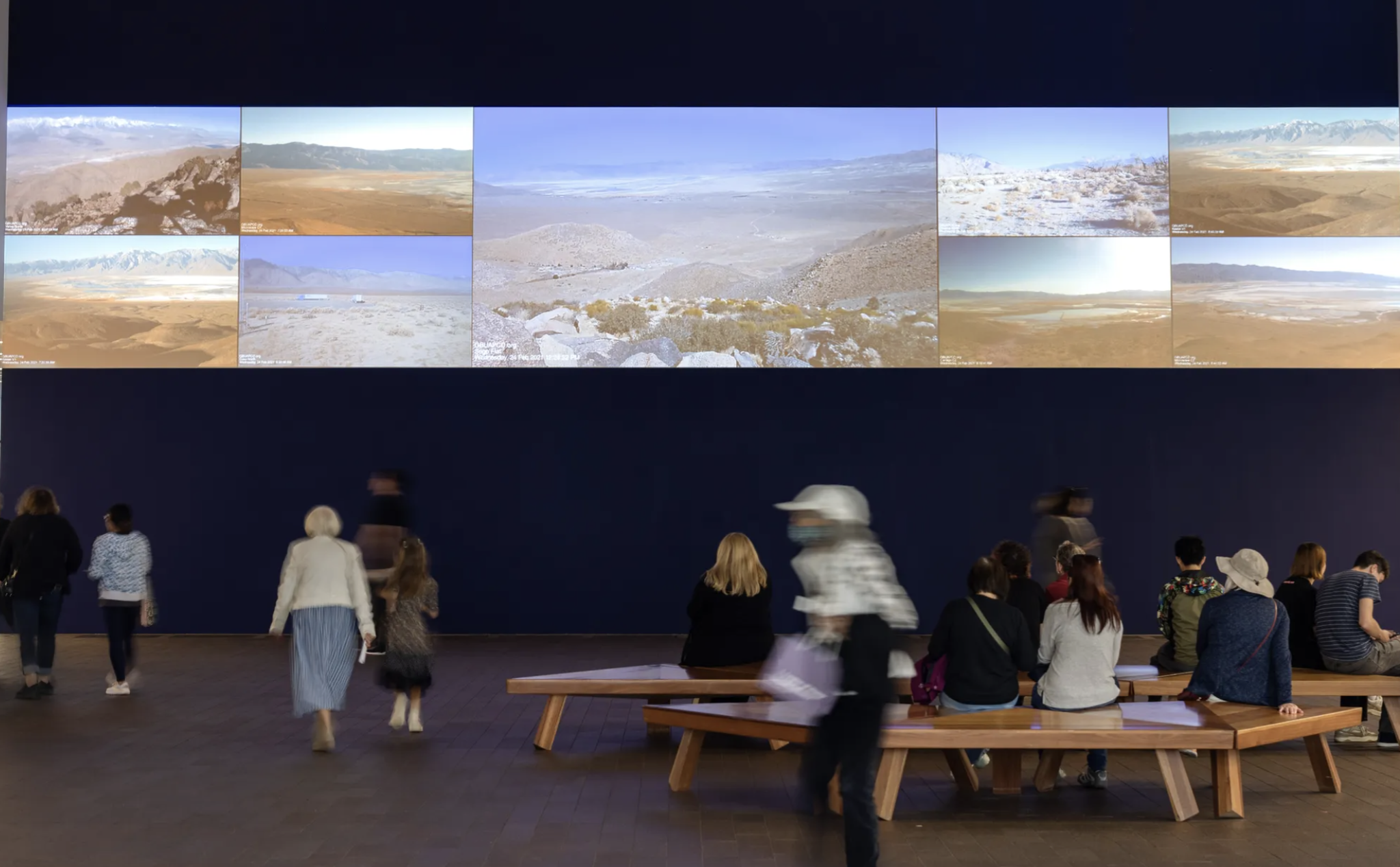Photograph of people viewing an art exhibition