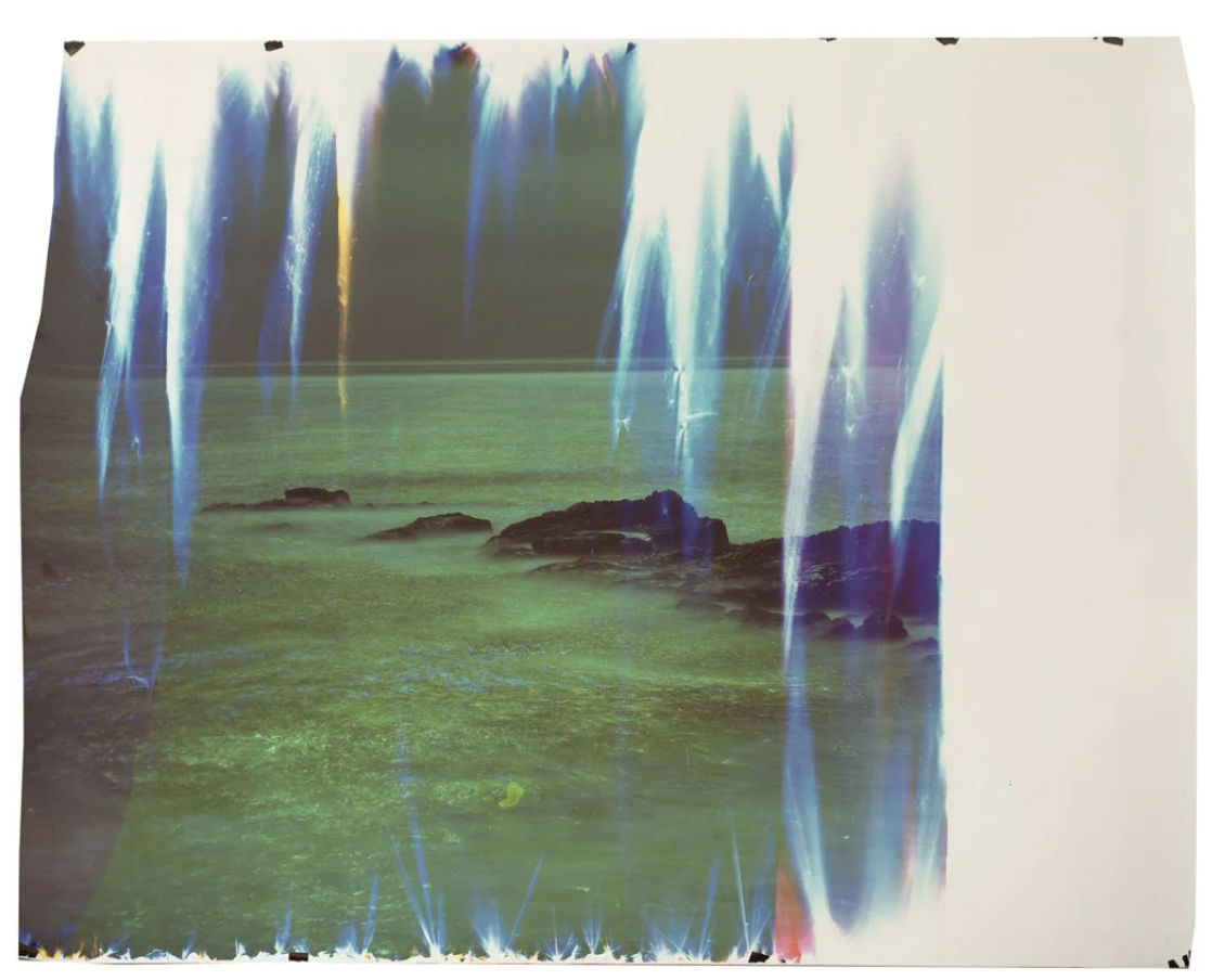 Abstract photograph of large rocks in a sea of water